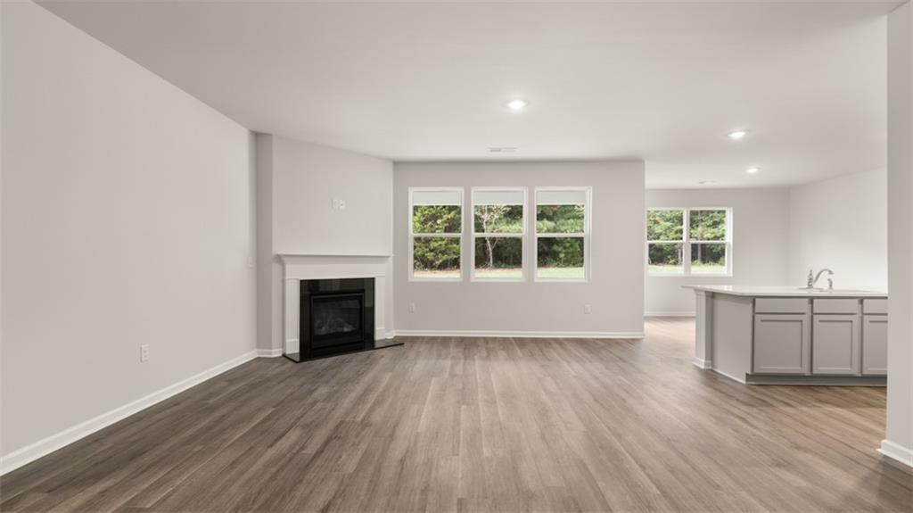 200 Defilippe Drive Statham, GA 30666 - Photo 25 of 60 wooden floor in an empty room with a window