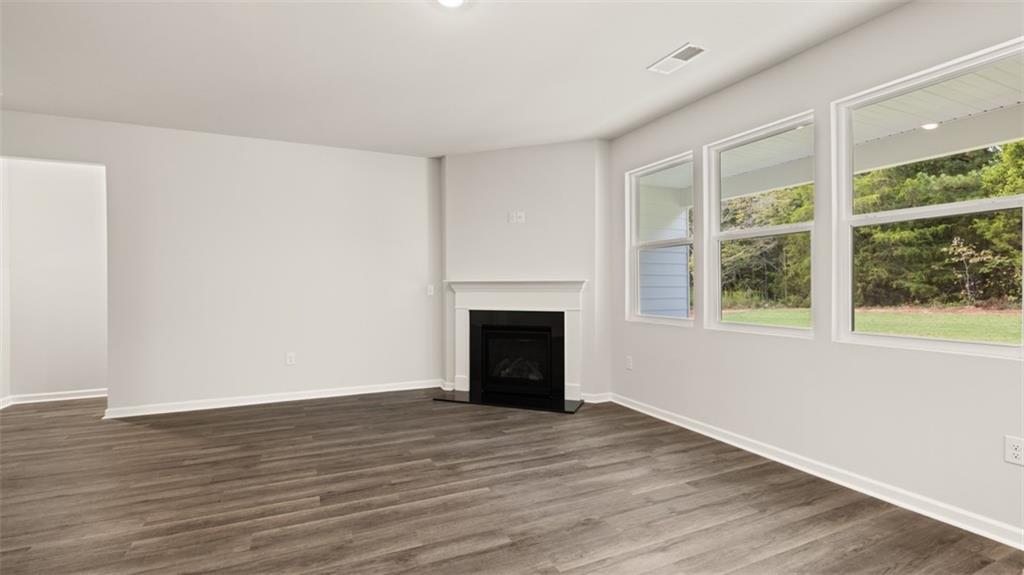 200 Defilippe Drive Statham, GA 30666 - Photo 27 of 60 a view of empty room with wooden floor and fireplace