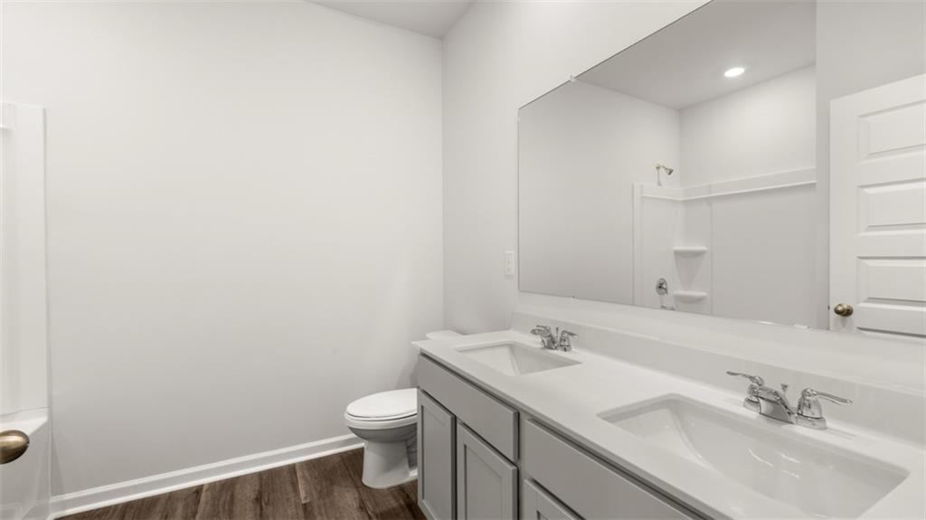 200 Defilippe Drive Statham, GA 30666 - Photo 34 of 60 a bathroom with a sink toilet and vanity