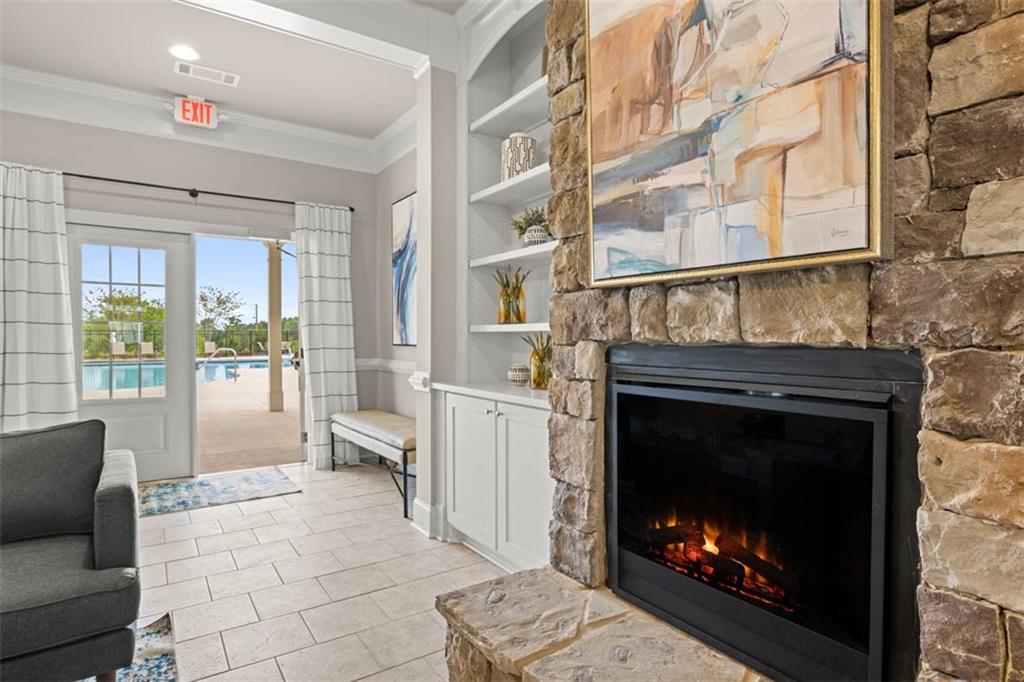 200 Defilippe Drive Statham, GA 30666 - Photo 59 of 60 a living room with furniture a flat screen tv and a fireplace