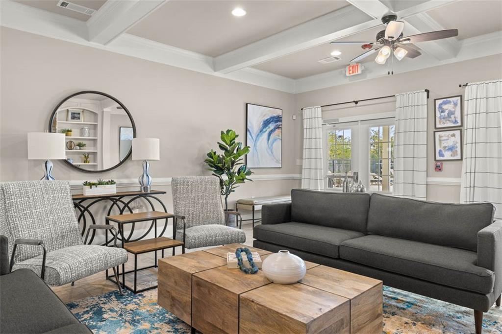200 Defilippe Drive Statham, GA 30666 - Photo 60 of 60 a living room with furniture a chandelier and a potted plant