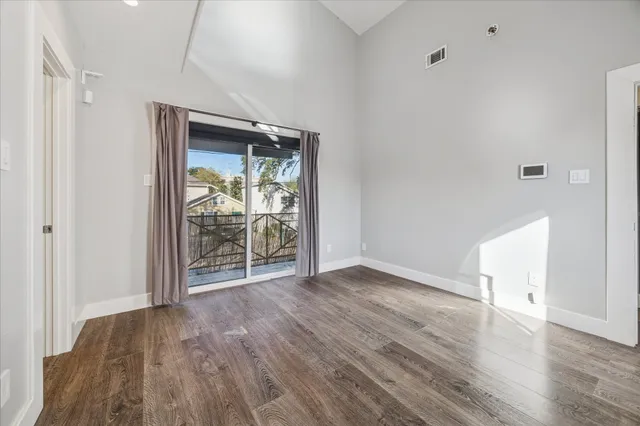 a bathroom with a granite countertop sink mirror and shower
