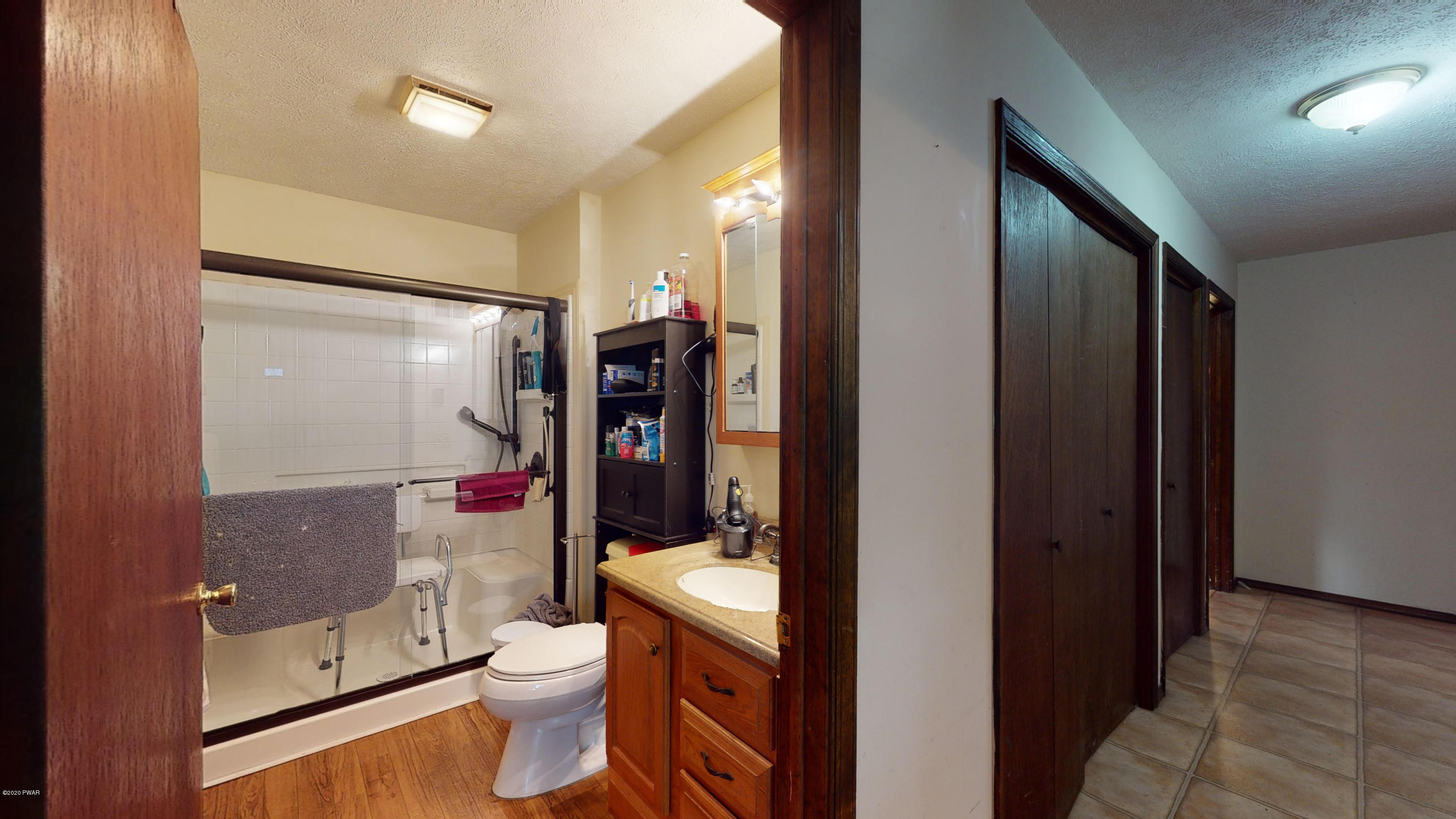 130 Maple Ridge Road Milford, PA 18337 - Photo 38 of 44 a bathroom with a toilet a sink and shower