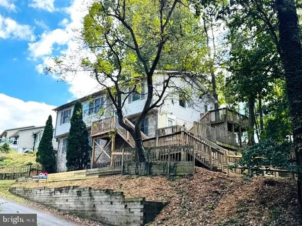 a view of a house with a tree
