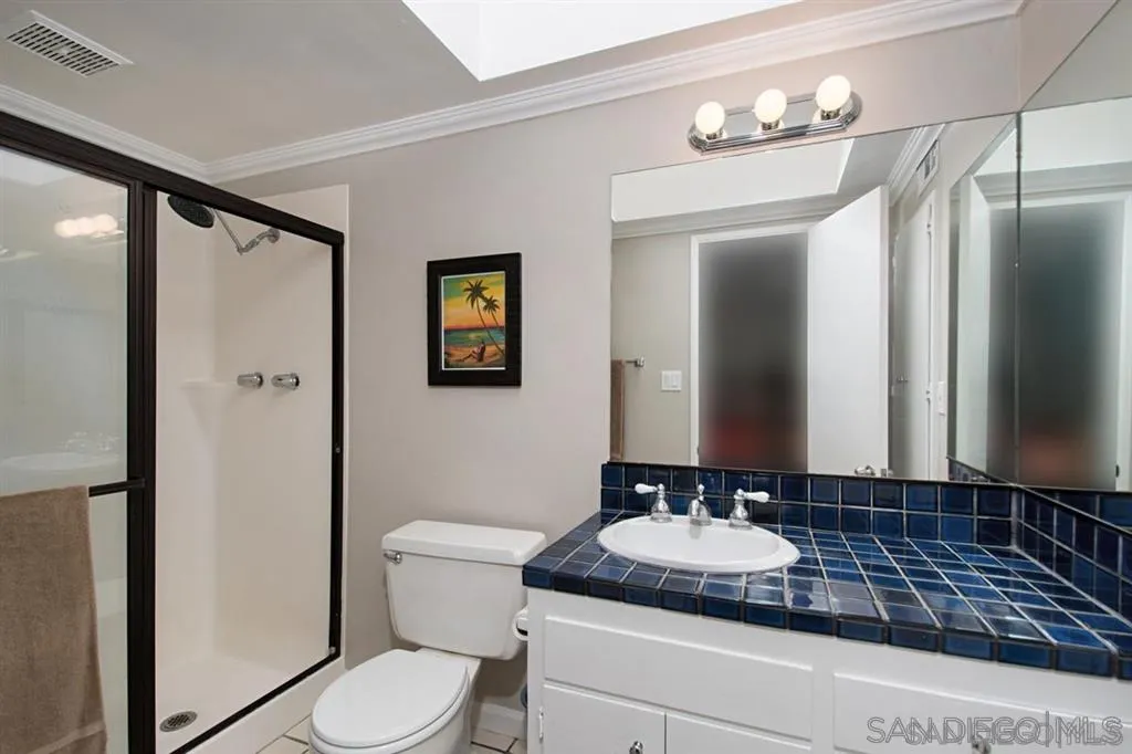 2022 Sheridan Road Encinitas, CA 92024 - Photo 11 of 25 a bathroom with a granite countertop sink toilet and shower
