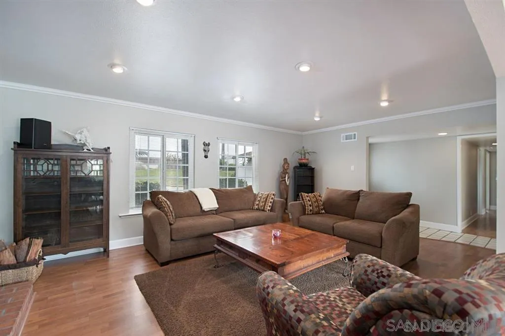 2022 Sheridan Road Encinitas, CA 92024 - Photo 2 of 25 a living room with furniture a ceiling fan and a rug