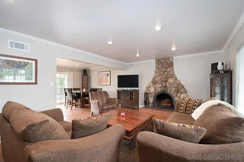 2022 Sheridan Road Encinitas, CA 92024 - Photo 3 of 25 a living room with furniture and a fireplace