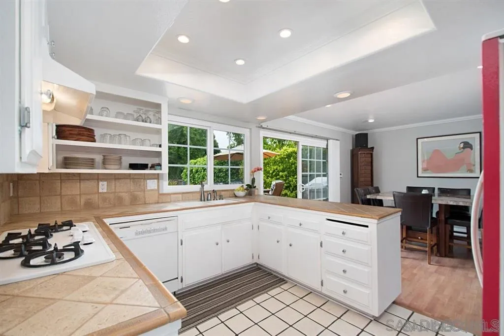 2022 Sheridan Road Encinitas, CA 92024 - Photo 8 of 25 a kitchen with a sink stove and cabinets