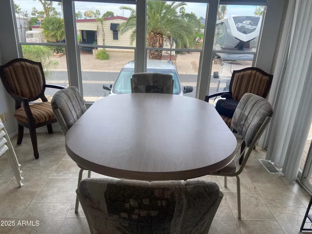 a view of a dining room with furniture window and outside view