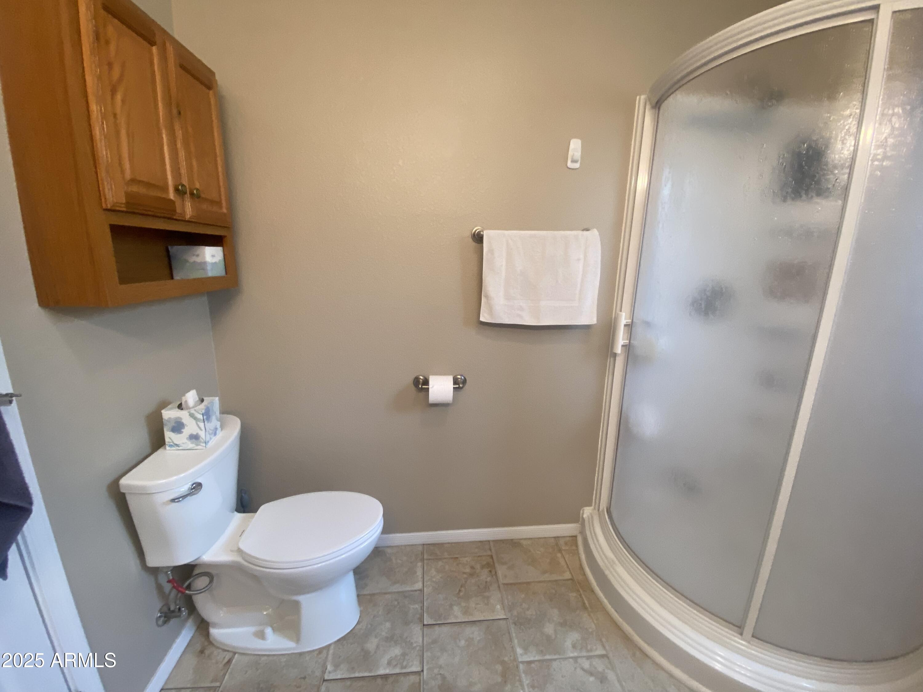 2355 South Pomo Avenue Apache Junction, AZ 85119 - Photo 23 of 32 a bathroom with a toilet and a mirror