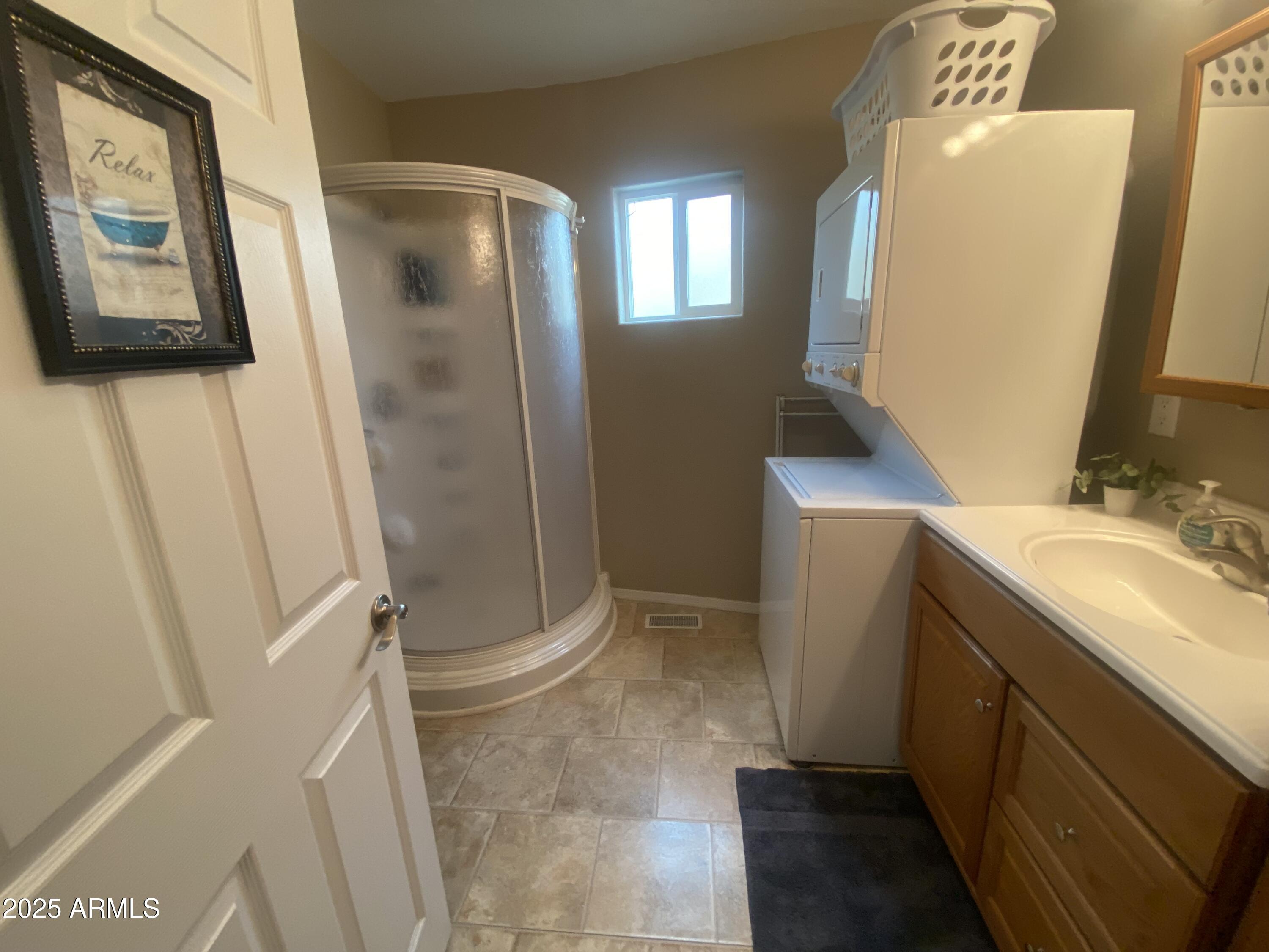 2355 South Pomo Avenue Apache Junction, AZ 85119 - Photo 24 of 32 a bathroom with a sink and mirror with toilet