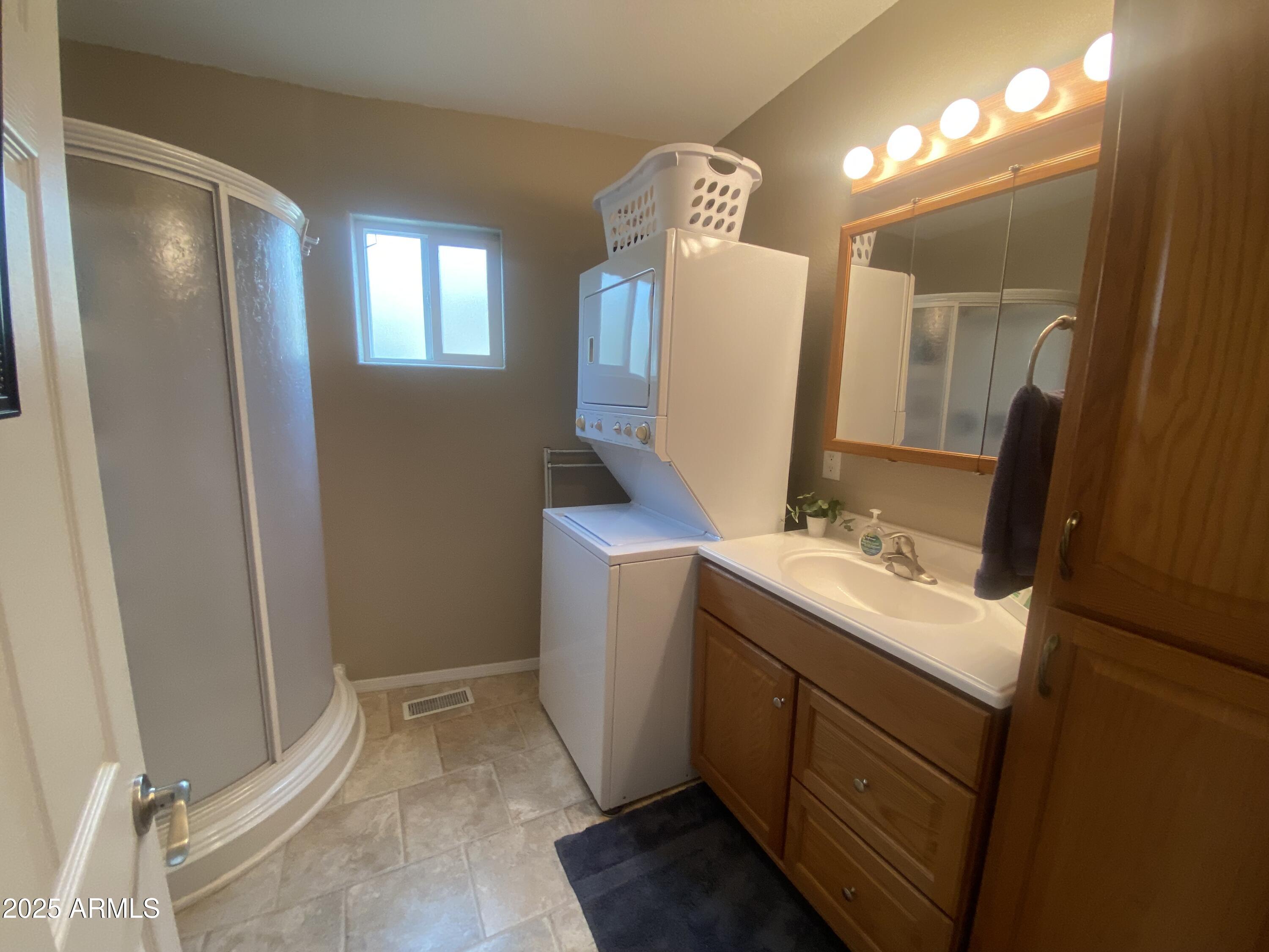2355 South Pomo Avenue Apache Junction, AZ 85119 - Photo 25 of 32 a bathroom with a sink and mirror with toilet
