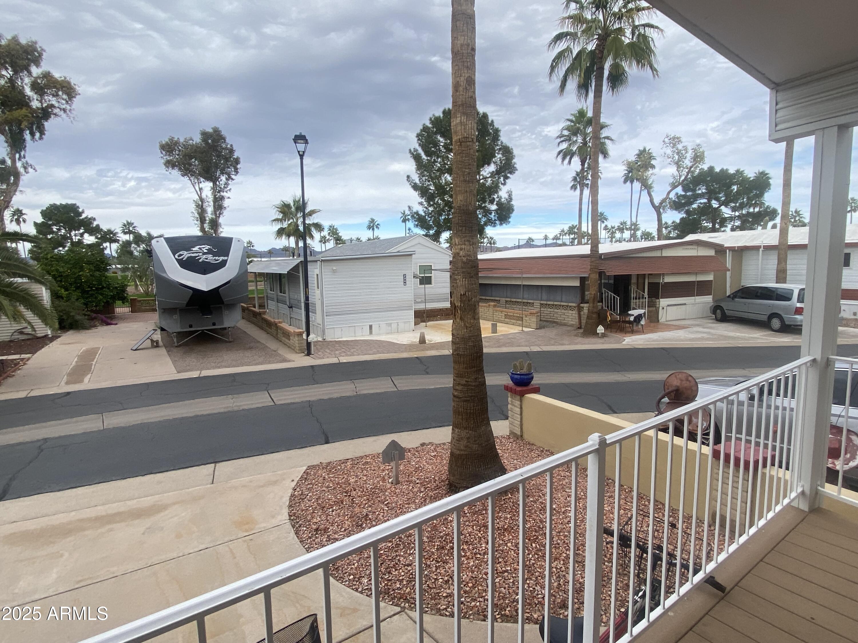 2355 South Pomo Avenue Apache Junction, AZ 85119 - Photo 29 of 32 a view of a balcony with potted plants
