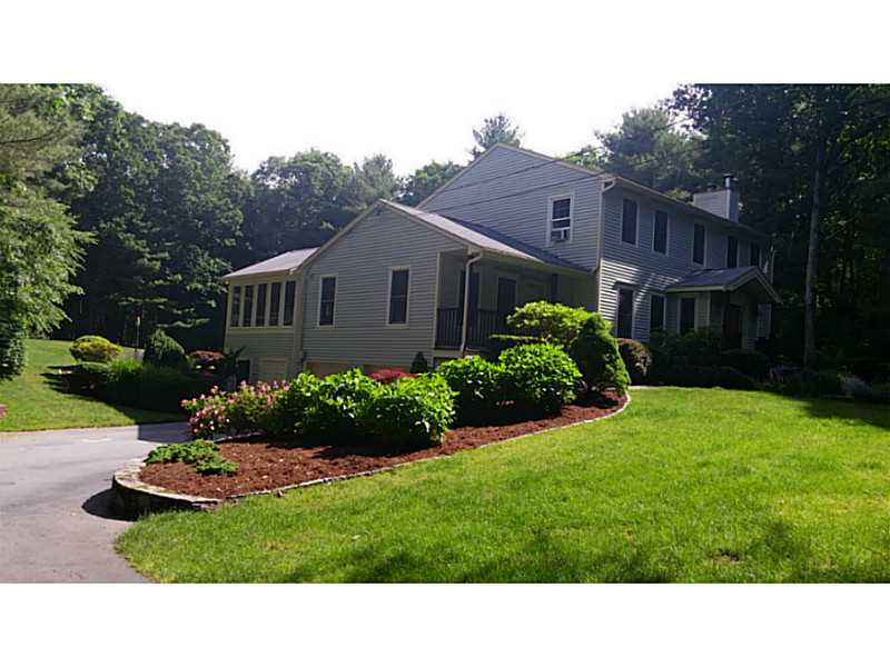 55 Falcon Ridge Drive Exeter, RI 02822 - Photo 1 of 25 Exterior Front. Private setting. Front porch, side garages, built in heated shed. Landscaped grounds