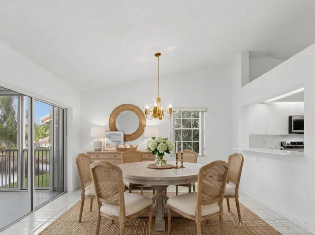 a kitchen with cabinets stainless steel appliances and a window