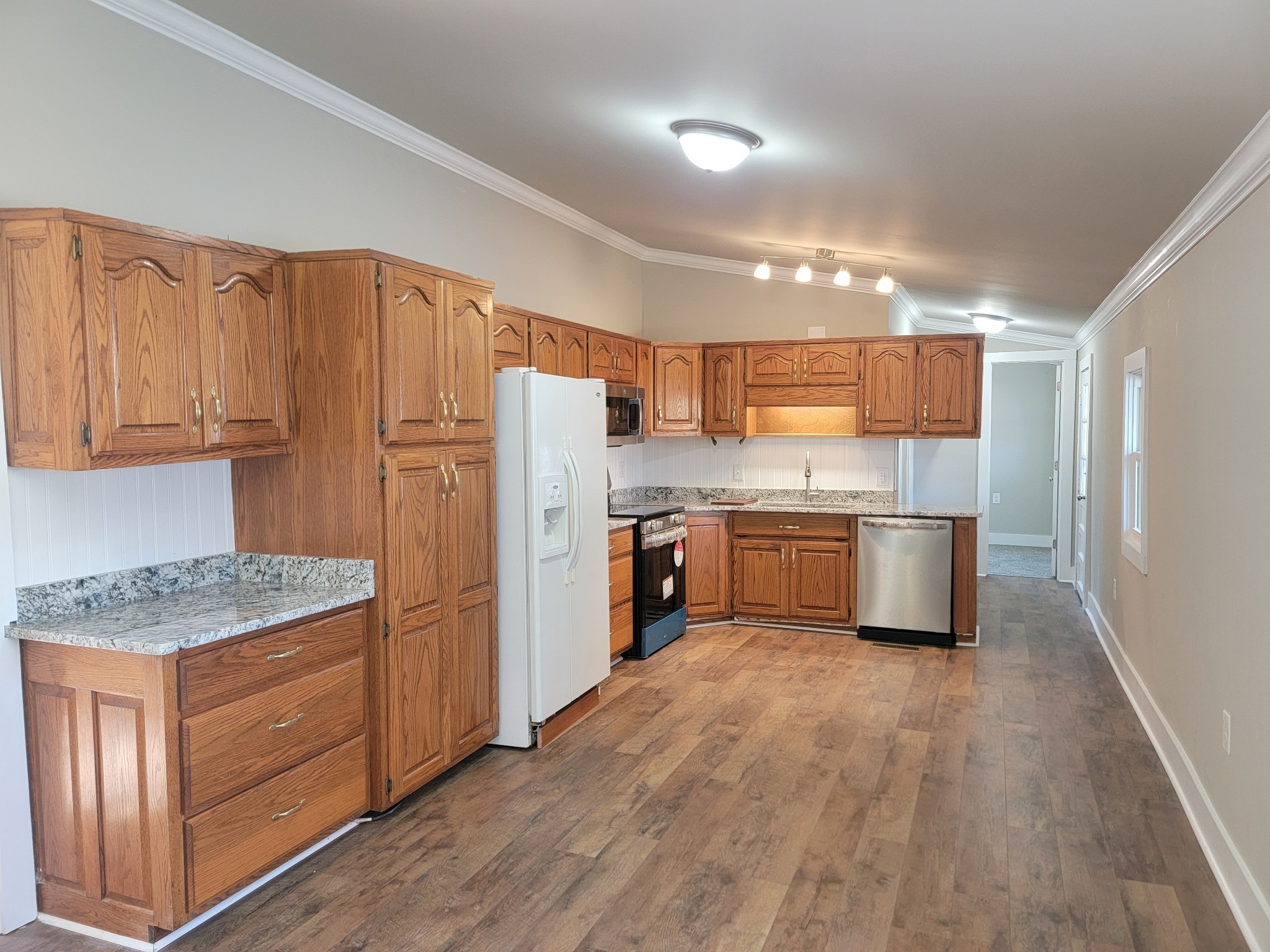 773 Shady Rest Road McMinnville, TN 37110 - Photo 5 of 14 a kitchen with stainless steel appliances a refrigerator a sink dishwasher and wooden cabinets