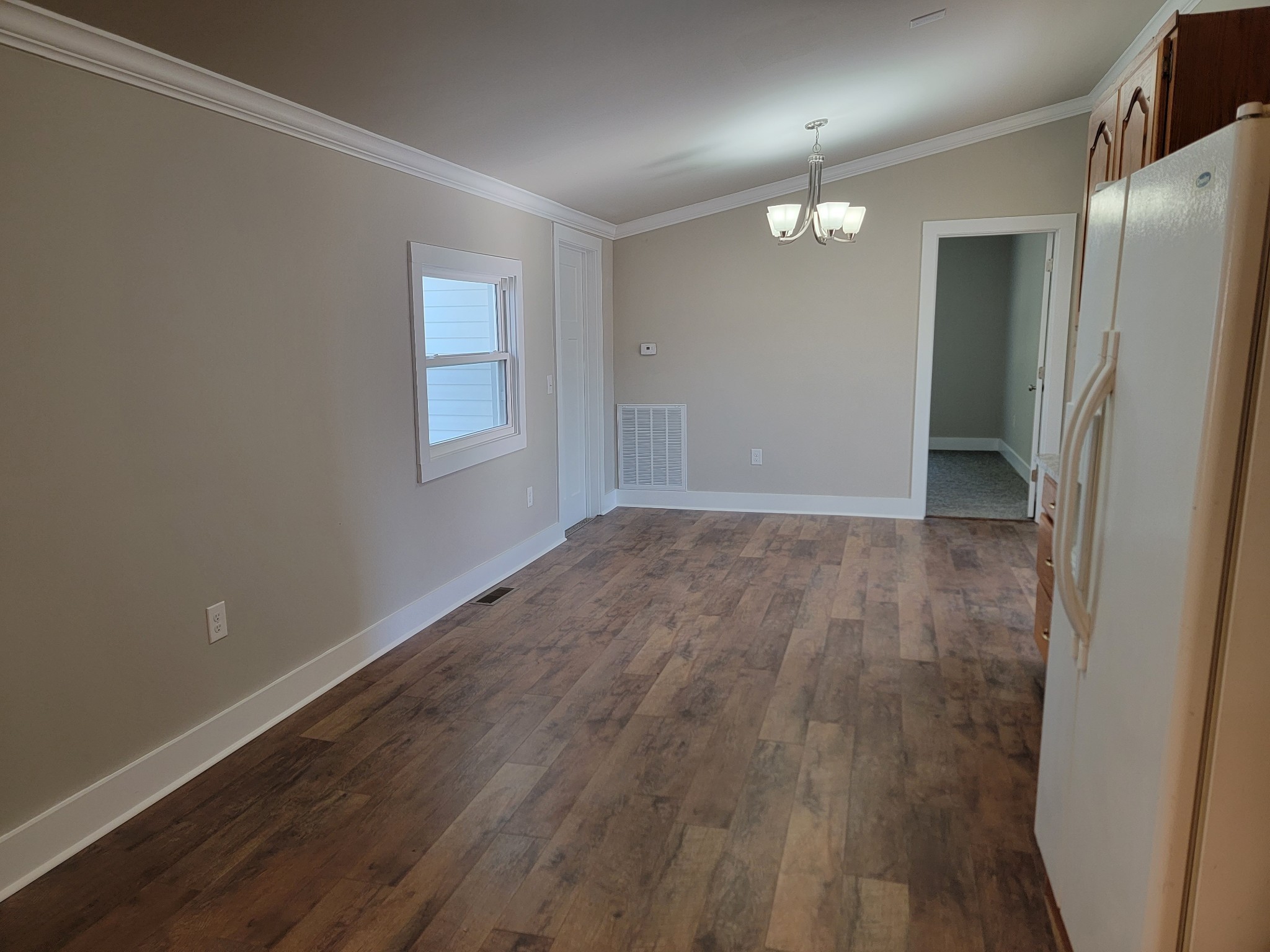 773 Shady Rest Road McMinnville, TN 37110 - Photo 7 of 14 an empty room with wooden floor and windows