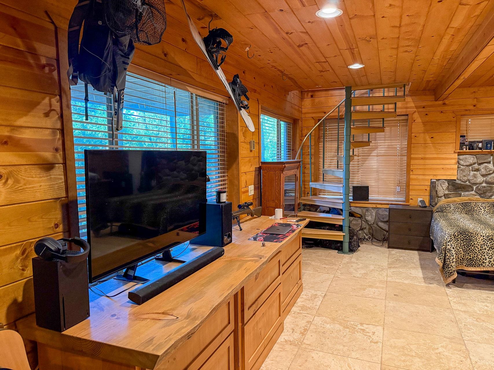 21819 Confidence Road Twain Harte, CA 95383 - Photo 13 of 15 a living room with furniture a flat screen tv and a fireplace