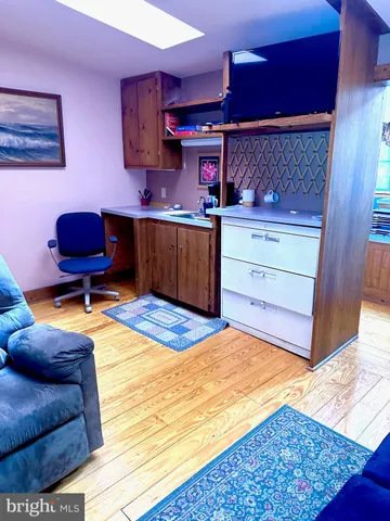 a room with a bed and furniture