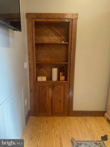 a bedroom with a bed and cabinets