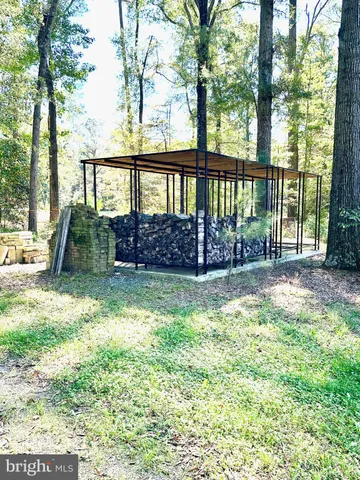 a view of outdoor space with a garden and swimming pool