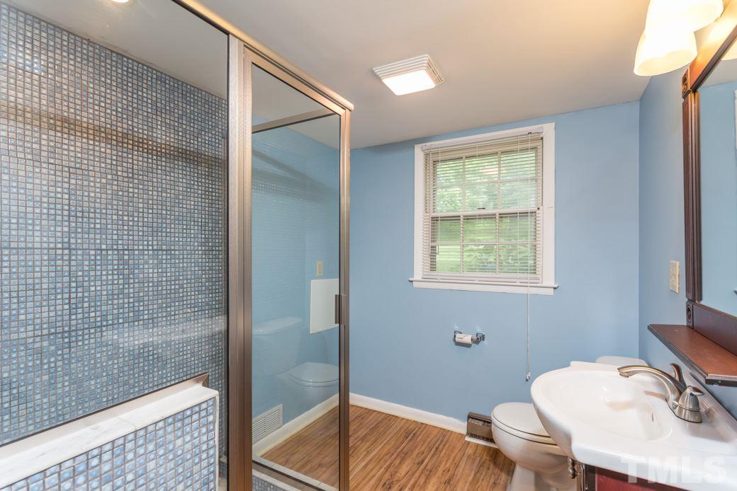 2108 Balboa Road Raleigh, NC 27603 - Photo 12 of 23 The upstairs bathroom has a beautifully tiled shower and laminate floor that will be yours to enjoy for many years to come!