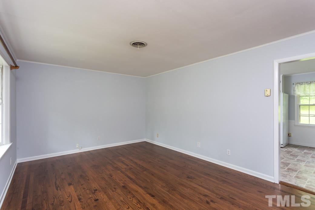 2108 Balboa Road Raleigh, NC 27603 - Photo 5 of 23 The stunning hardwood floor gleams in the Family Room!