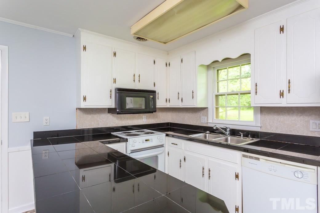 2108 Balboa Road Raleigh, NC 27603 - Photo 7 of 23 The quartz tile countertops are just beautiful!