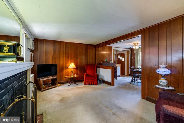 a view of a livingroom with furniture and a flat screen tv