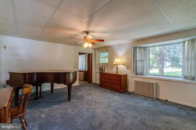 a bed room with furniture and a window