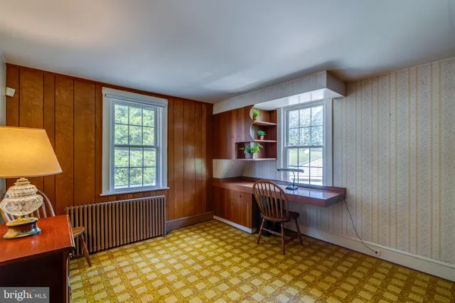 a workspace with furniture and a window