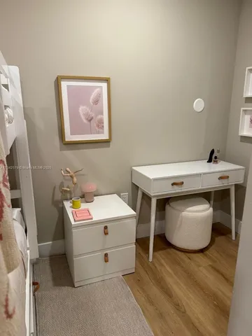 a bedroom with a bed and a desk