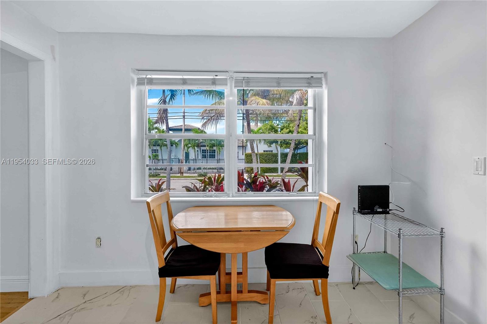 2399 Southwest 26th Lane Miami, FL 33133 - Photo 6 of 39 a view of a dining room with furniture window and outside view