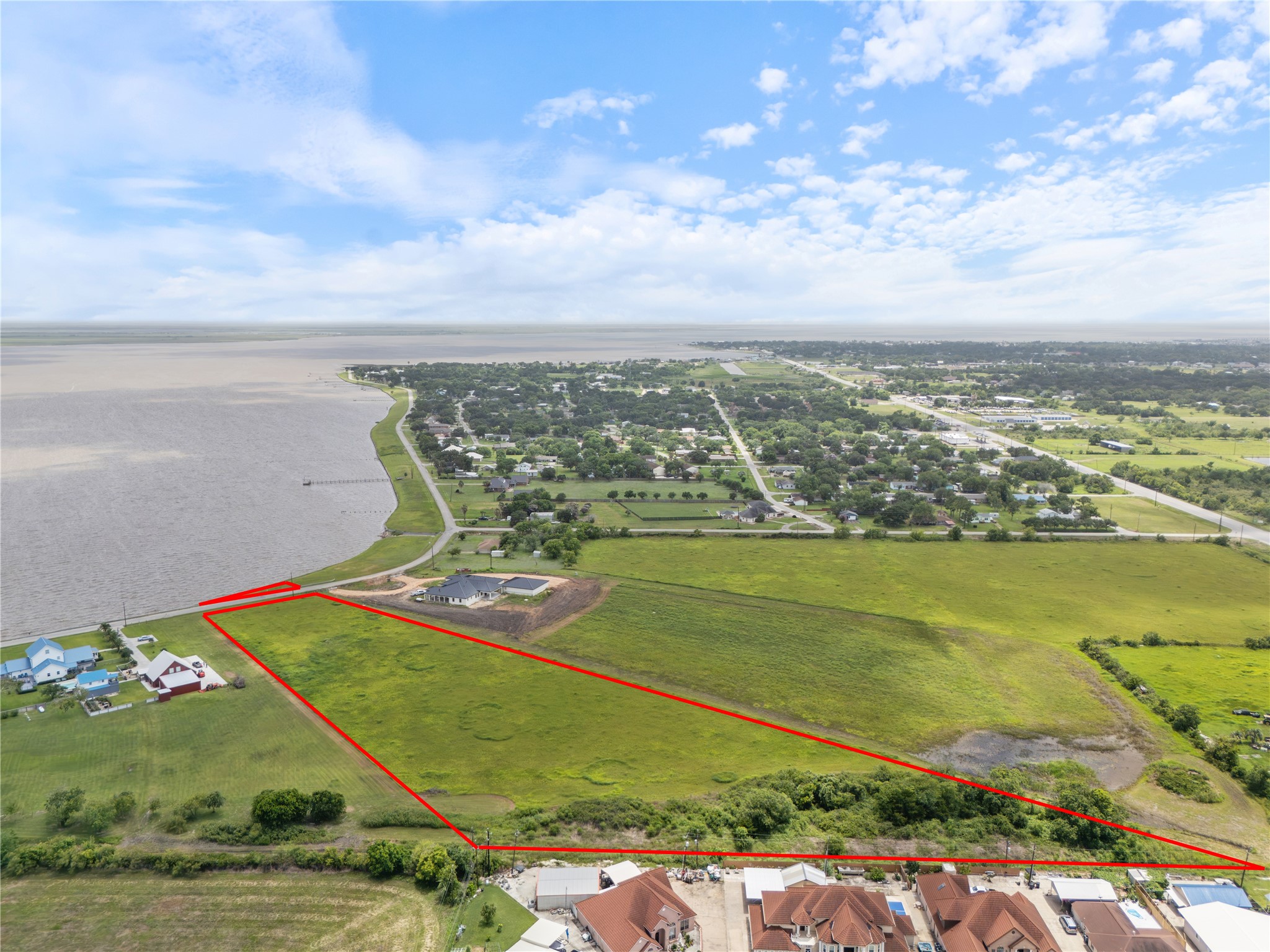 305 Bayshore Road Palacios, TX 77465 - Photo 2 of 25 A sprawling waterfront lot presents a rare development opportunity.