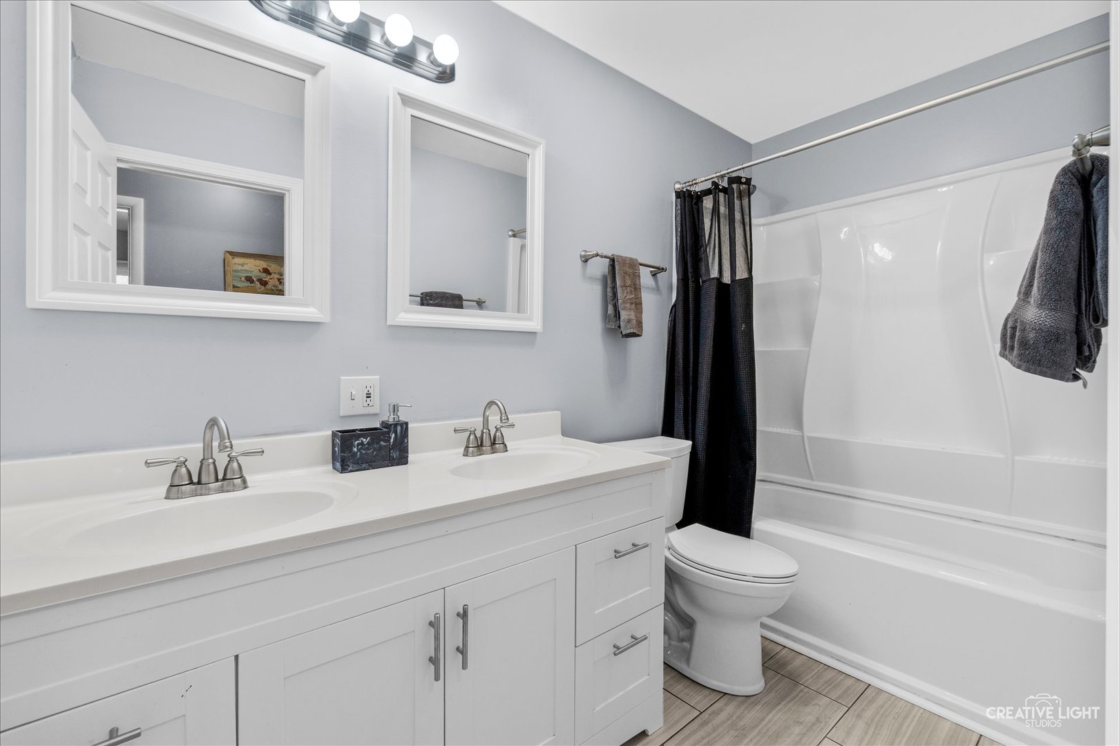 4 Woodcliff Road Montgomery, IL 60538 - Photo 12 of 18 a bathroom with a sink a toilet and shower