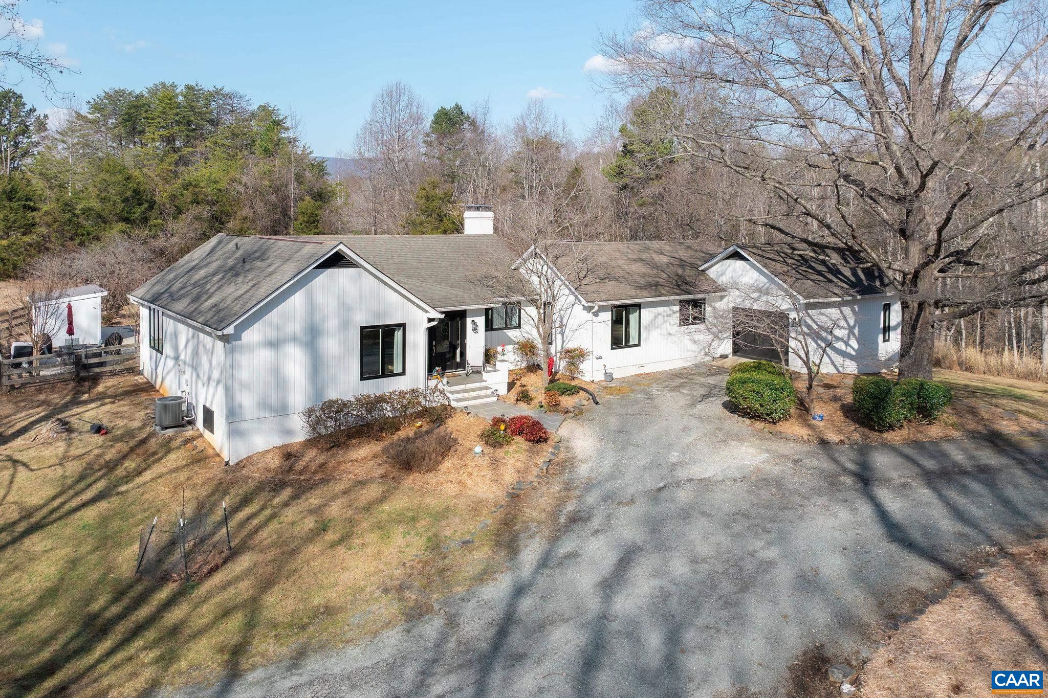 2795 Pea Ridge Road Charlottesville, VA 22901 - Photo 34 of 54 a view of house with yard and trees in the background
