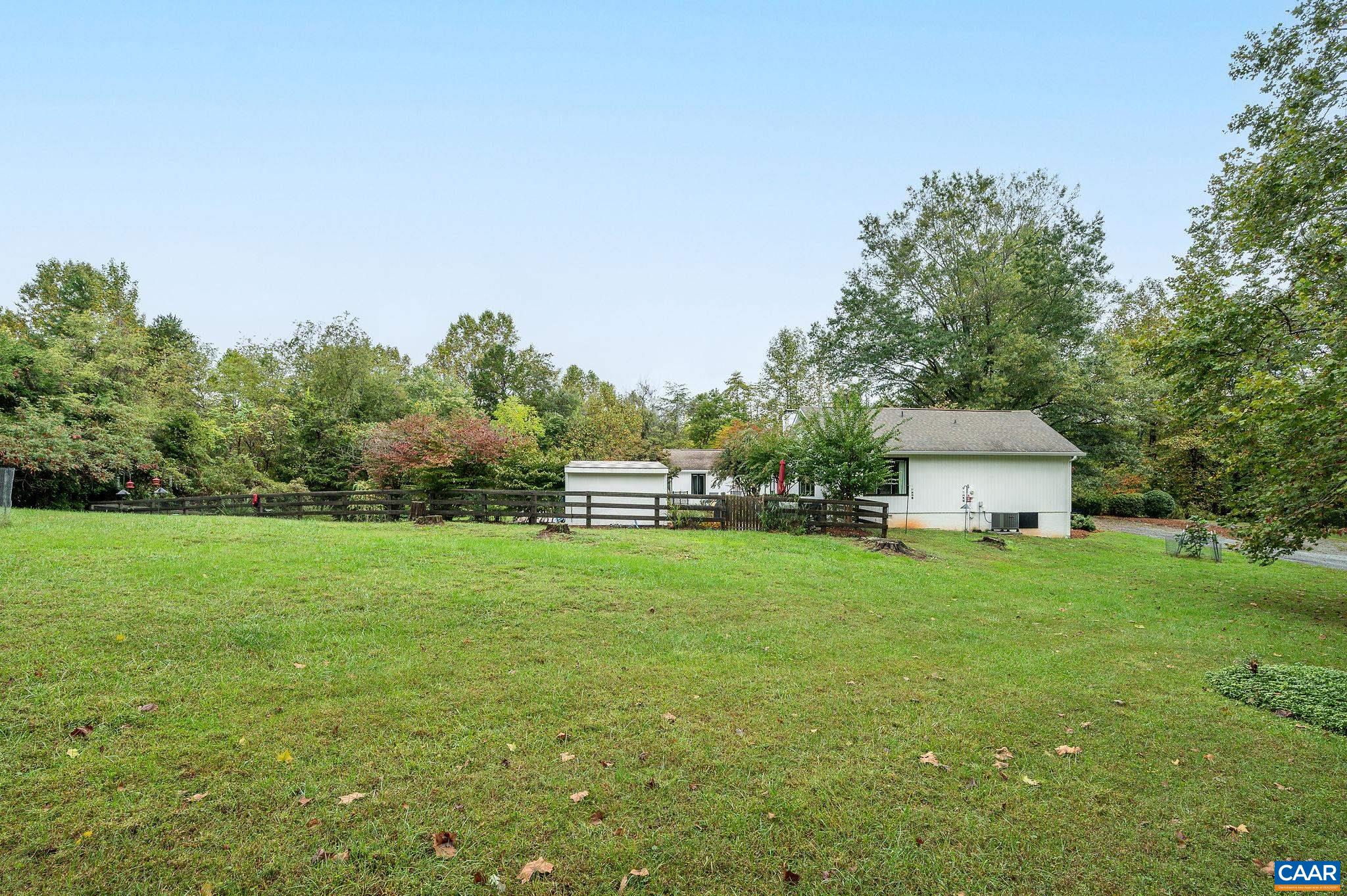2795 Pea Ridge Road Charlottesville, VA 22901 - Photo 47 of 54 a front view of a house with a yard and trees