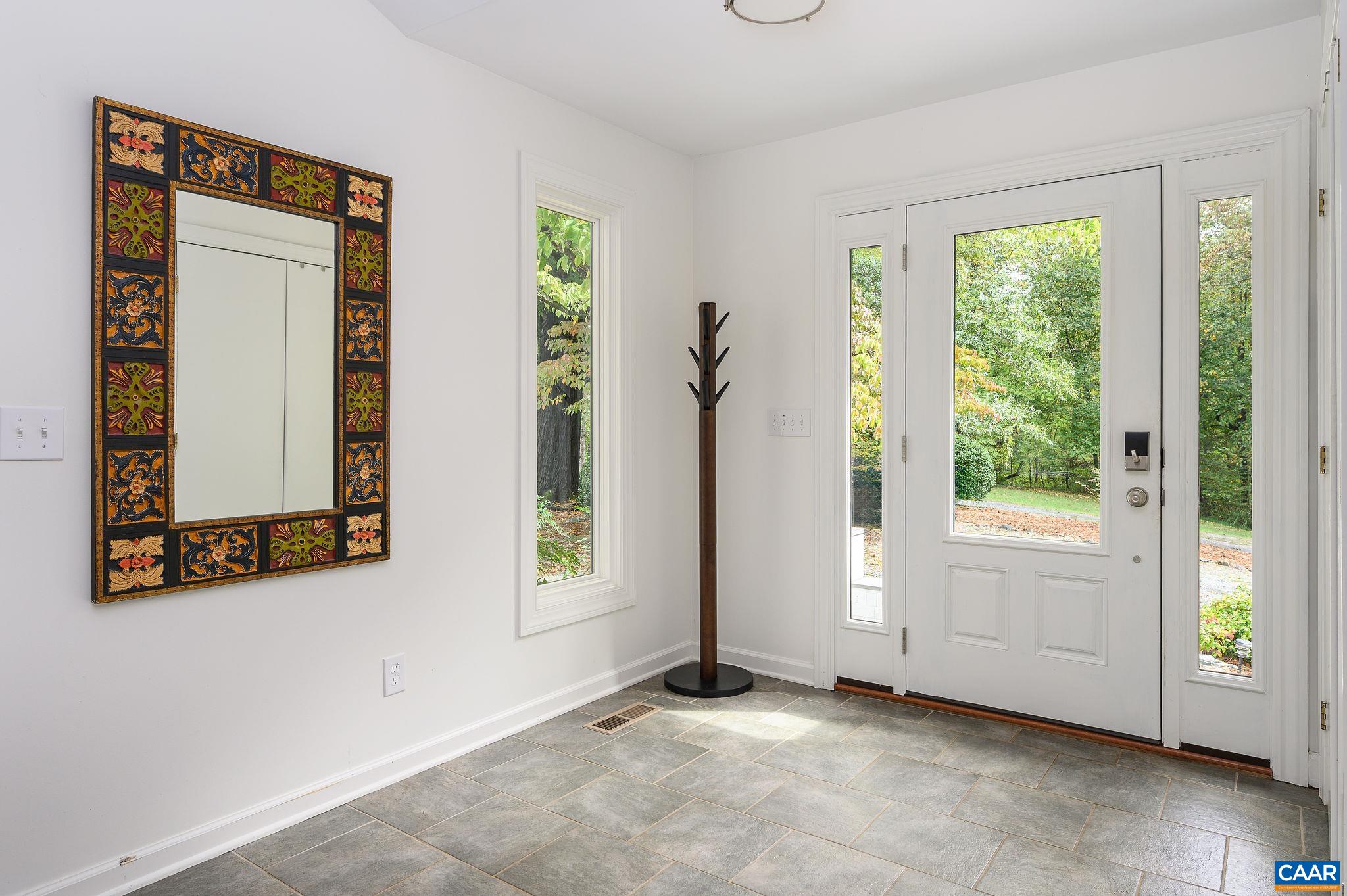 2795 Pea Ridge Road Charlottesville, VA 22901 - Photo 6 of 54 a view of an empty room with a window