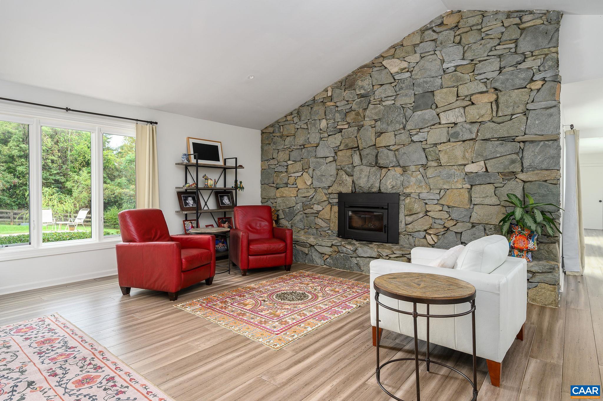 2795 Pea Ridge Road Charlottesville, VA 22901 - Photo 8 of 54 a living room with furniture and a fireplace