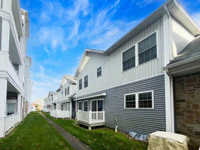 a view of backyard with barbeque grill and stairs