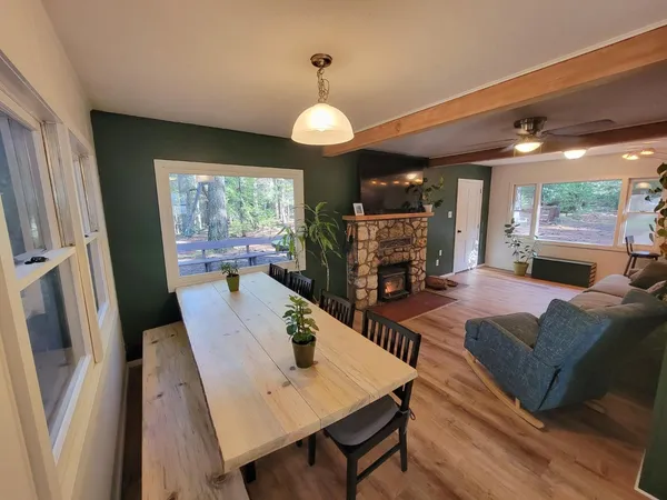 a view of a dining room with furniture window and wooden floor