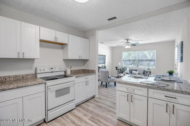 a bathroom with a sink mirror and toilet