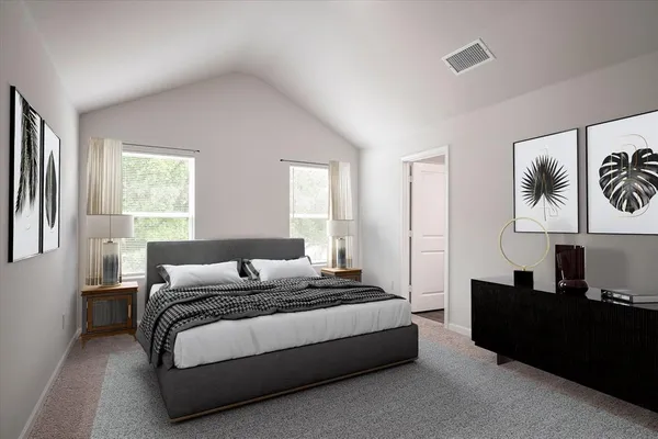 a bedroom with a bed and a couch