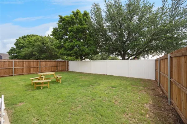 a white refrigerator freezer sitting in a kitchen