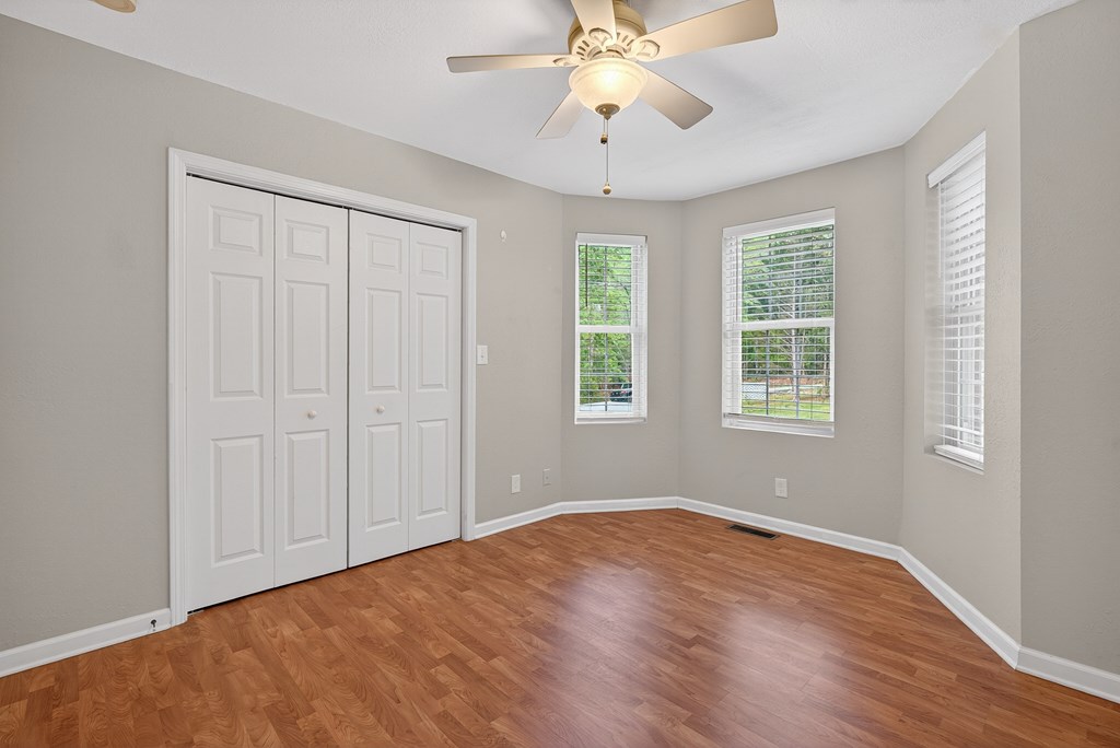 80 Sowers Road Blue Ridge, GA 30513 - Photo 11 of 58 a view of an empty room with a window and wooden floor
