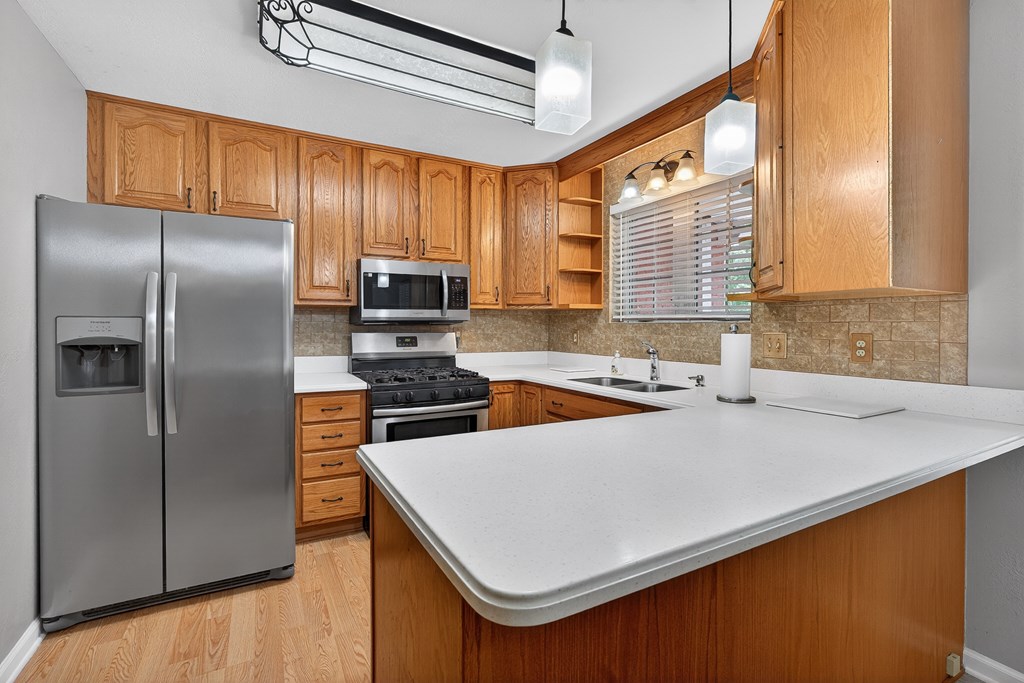 80 Sowers Road Blue Ridge, GA 30513 - Photo 14 of 58 a kitchen with stainless steel appliances a refrigerator a sink a stove and a refrigerator
