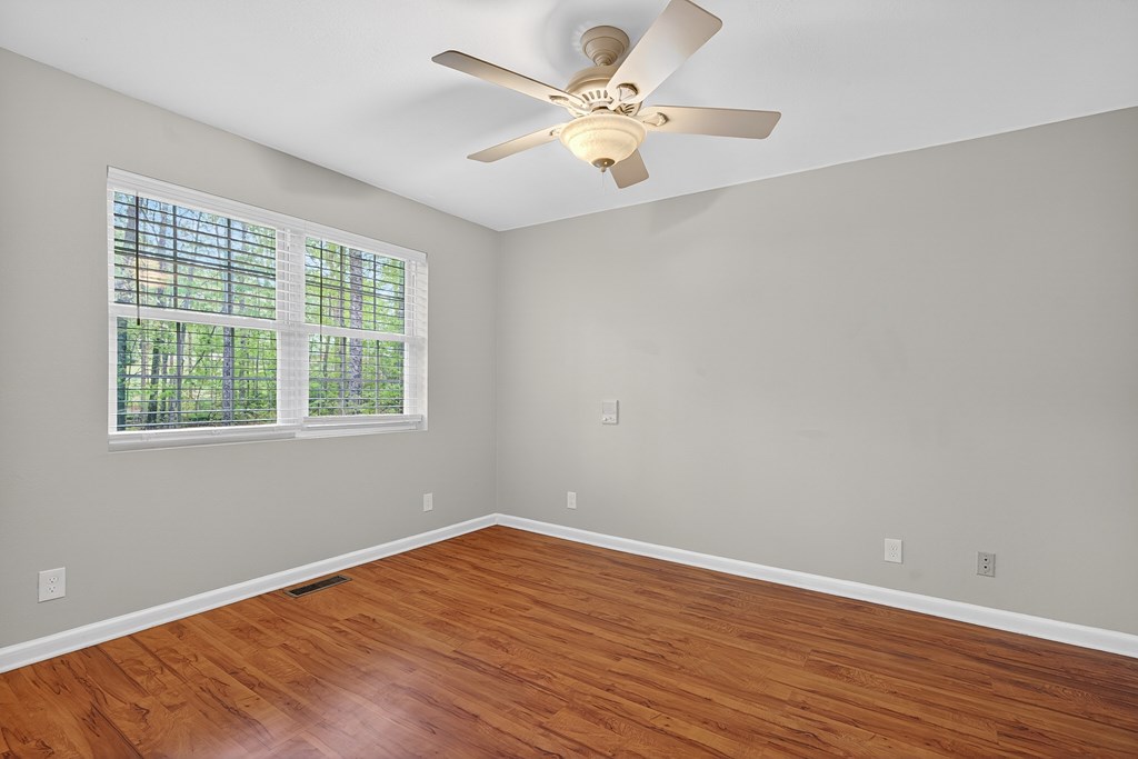 80 Sowers Road Blue Ridge, GA 30513 - Photo 19 of 58 wooden floor in an empty room with a window