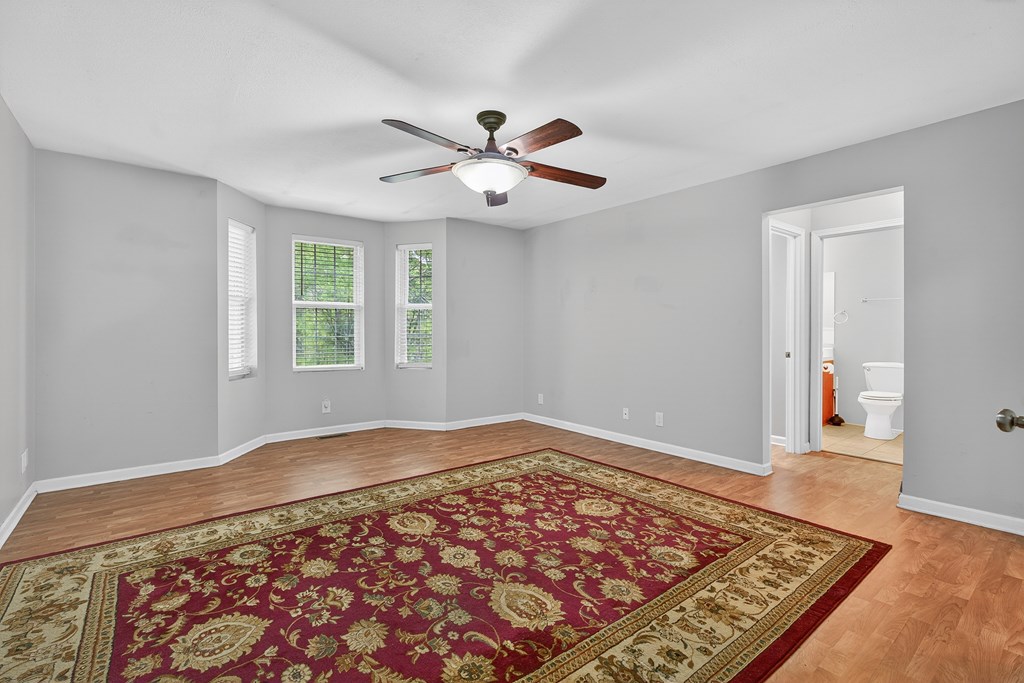 80 Sowers Road Blue Ridge, GA 30513 - Photo 21 of 58 a view of an empty room with window and wooden floor