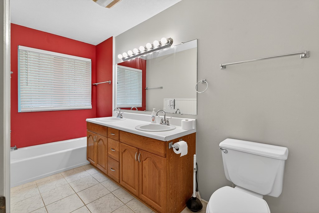 80 Sowers Road Blue Ridge, GA 30513 - Photo 22 of 58 a bathroom with a toilet sink and mirror