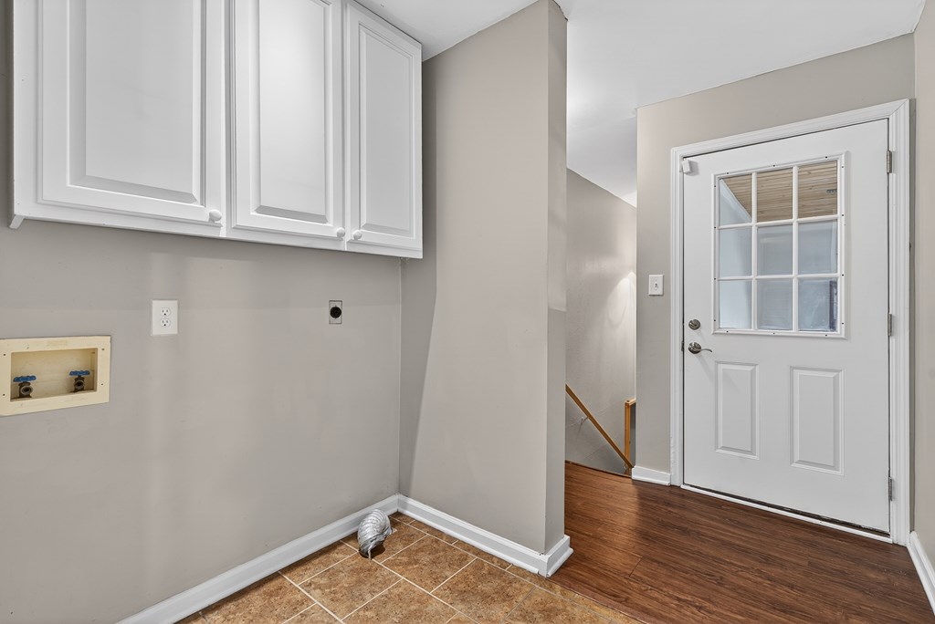 80 Sowers Road Blue Ridge, GA 30513 - Photo 24 of 58 an empty room with wooden floor and cabinet